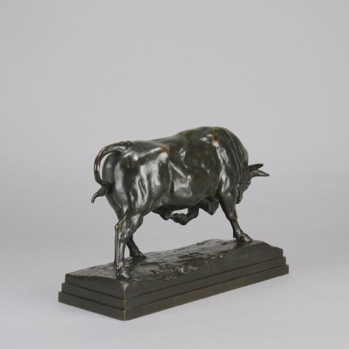 fig 6. A mid-19th-century dark patinated bronze sculpture of a standing bull with muscular details on an integral bronze base.