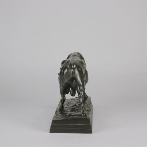 fig 7. A mid-19th-century dark patinated bronze sculpture of a standing bull with muscular details on an integral bronze base.