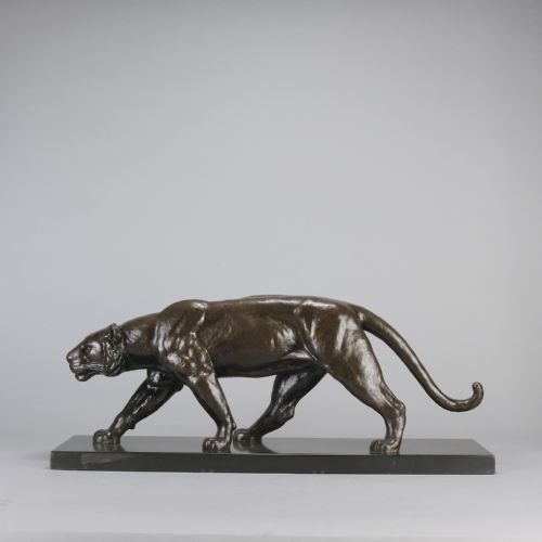 fig 1. An Art Deco dark bronze sculpture of a muscular stalking panther mounted on a thin rectangular dark marble base.
