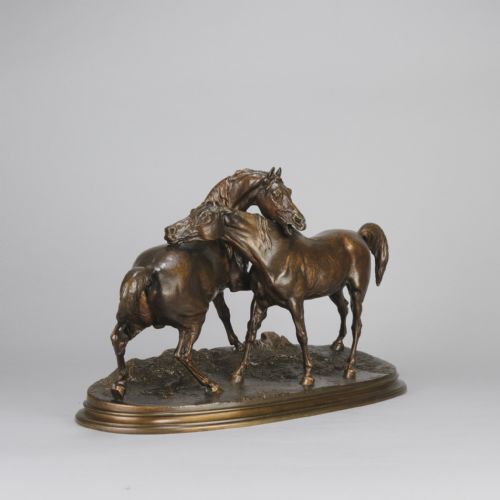 fig 4. A mid-19th-century patinated bronze sculpture depicting two horses nuzzling each other on an oval moulded base.