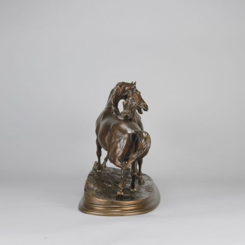 fig 5. A mid-19th-century patinated bronze sculpture depicting two horses nuzzling each other on an oval moulded base.