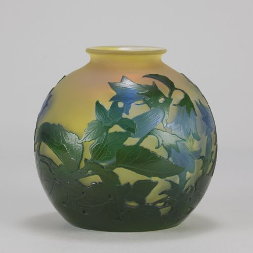 fig 2. A spherical Art Nouveau cameo glass vase featuring green and blue etched bellflowers over a frosted yellow background.