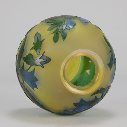 fig 9. A spherical Art Nouveau cameo glass vase featuring green and blue etched bellflowers over a frosted yellow background.