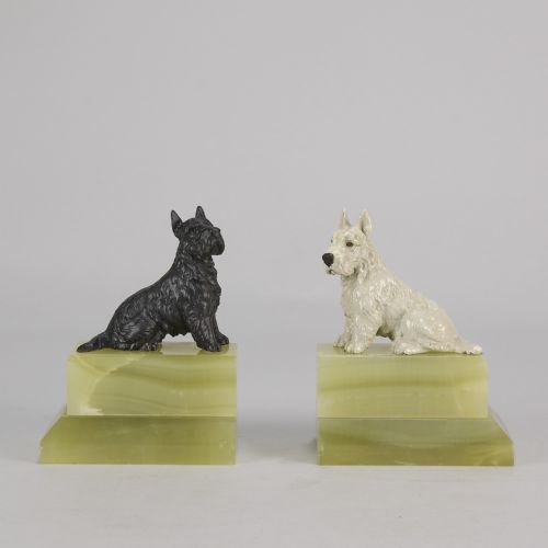 fig 1. Pair of antique cold-painted bronze terrier dogs mounted on stepped green onyx bookend bases.
