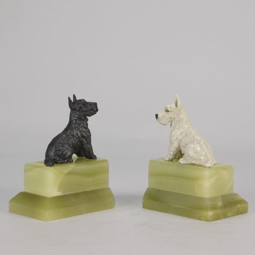 fig 2. Pair of antique cold-painted bronze terrier dogs mounted on stepped green onyx bookend bases.