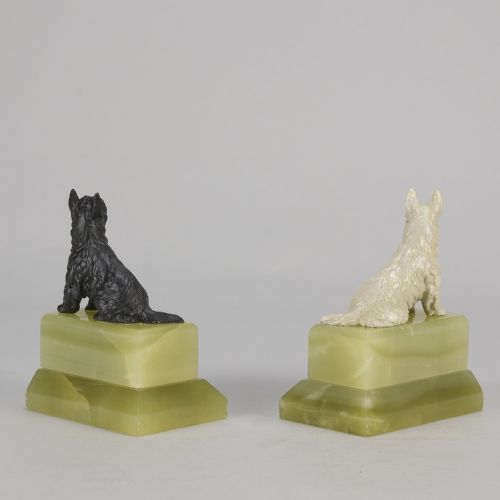 fig 3. Pair of antique cold-painted bronze terrier dogs mounted on stepped green onyx bookend bases.