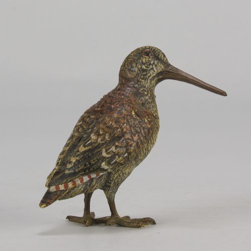 fig 2. An early 20th-century cold-painted bronze figure of a woodcock bird standing with textured plumage and a long beak.