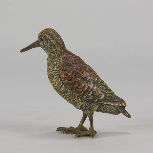 fig 4. An early 20th-century cold-painted bronze figure of a woodcock bird standing with textured plumage and a long beak.
