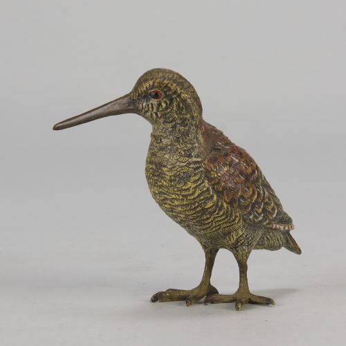 fig 5. An early 20th-century cold-painted bronze figure of a woodcock bird standing with textured plumage and a long beak.