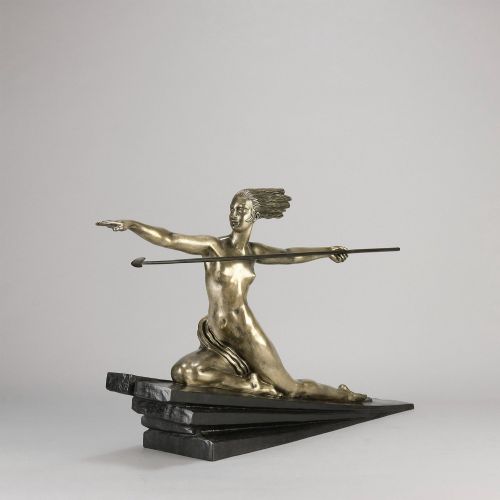 fig 2. An Art Deco silvered metal sculpture depicting a stylized female archer holding a spear, mounted on a stepped black base.