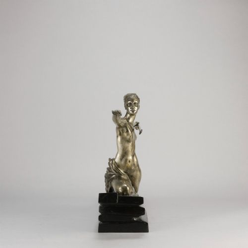 fig 3. An Art Deco silvered metal sculpture depicting a stylized female archer holding a spear, mounted on a stepped black base.