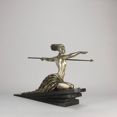 fig 4. An Art Deco silvered metal sculpture depicting a stylized female archer holding a spear, mounted on a stepped black base.