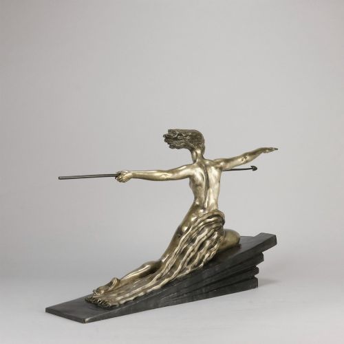 fig 6. An Art Deco silvered metal sculpture depicting a stylized female archer holding a spear, mounted on a stepped black base.