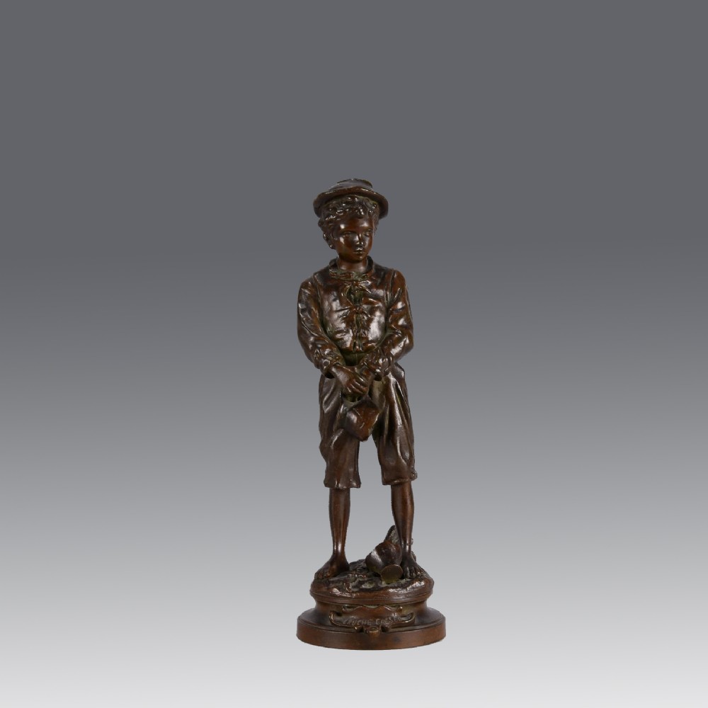 A late 19th-century patinated bronze sculpture of a young boy wearing a cap and holding a broken jug, standing on a circular cast base.