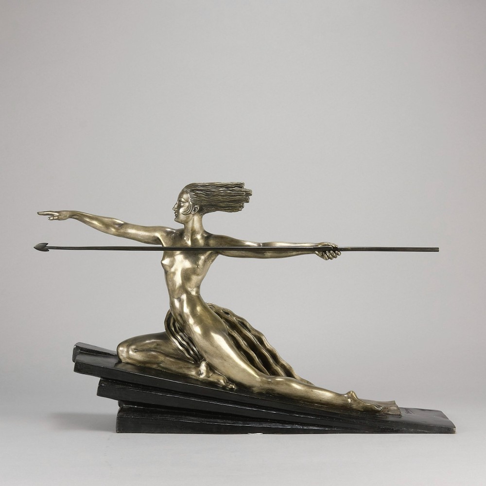 An Art Deco silvered metal sculpture depicting a stylized female archer holding a spear, mounted on a stepped black base. View II