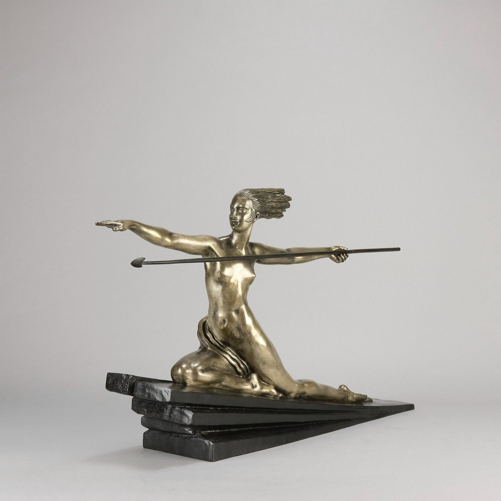 An Art Deco silvered metal sculpture depicting a stylized female archer holding a spear, mounted on a stepped black base. View III