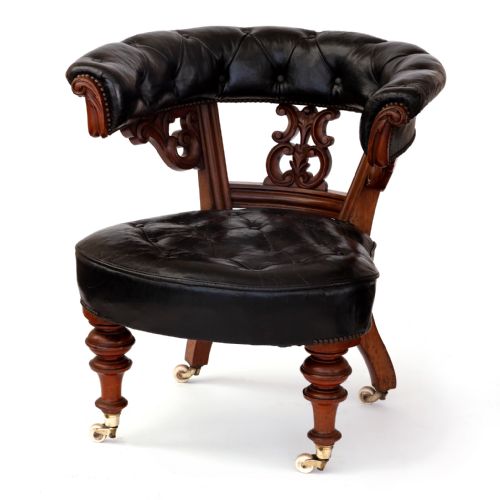 HEAVILY CARVED WALNUT LIBRARY CHAIR WITH ORIGINAL LEATHER COVERING