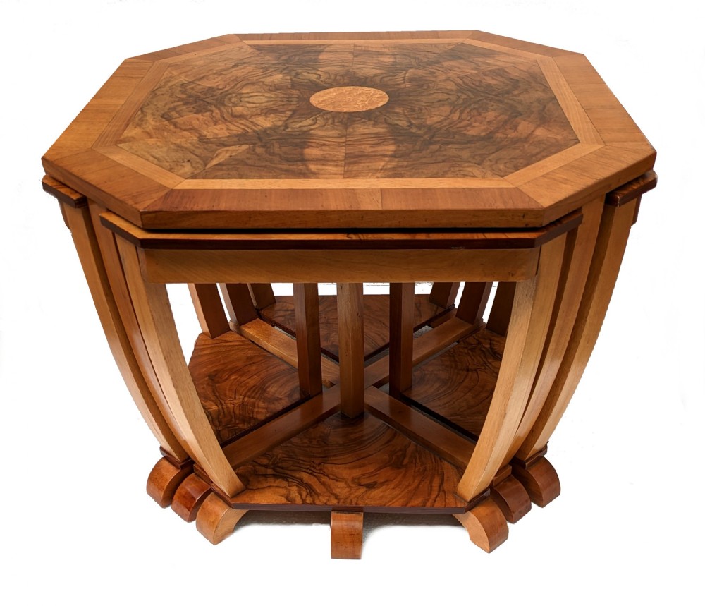 An octagonal 1930s Art Deco walnut nest of tables featuring quarter-matched burr walnut veneer top and four fitted triangular side tables. View V