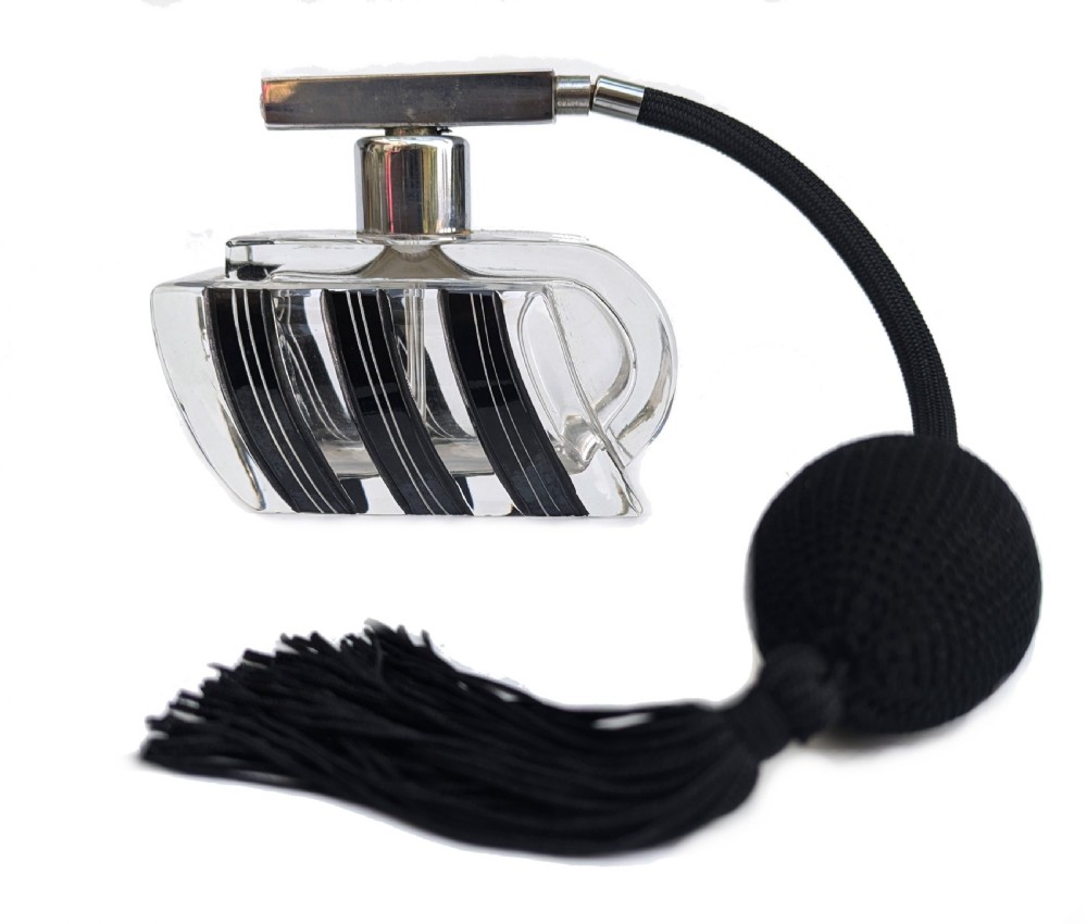An Art Deco clear glass perfume atomiser featuring painted black geometric stripes, chrome metal hardware, and a black fabric squeeze bulb with a long tassel.