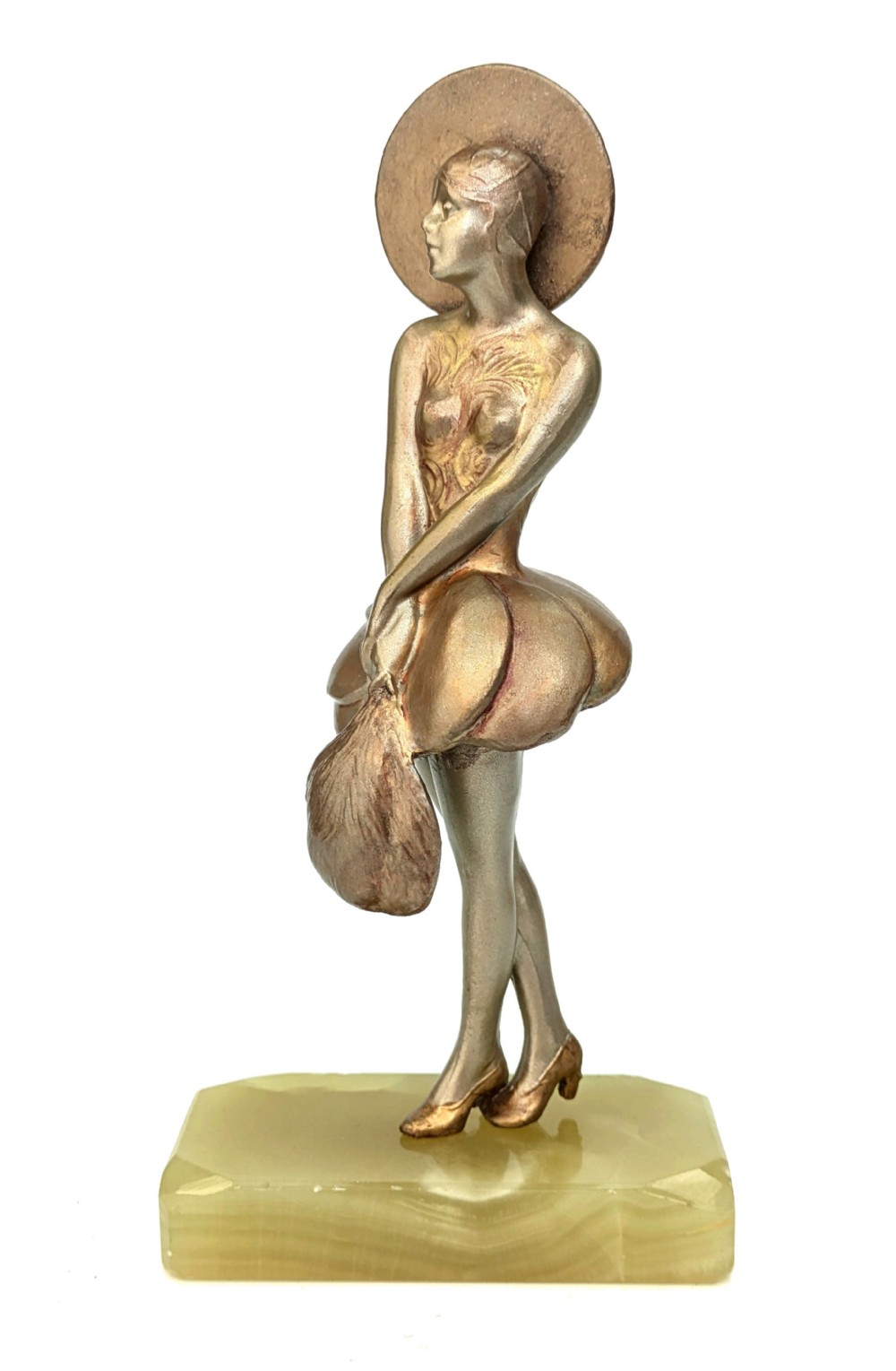 An Art Deco spelter statuette depicting a stylised female figure with a circular headpiece, positioned on a chamfered green onyx base.