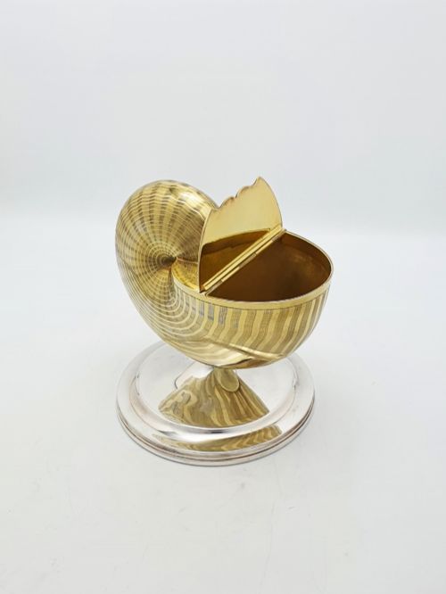 fig 1. A Victorian silver-plated and gilt metal spoon warmer designed in the form of a nautilus shell on a pedestal base.