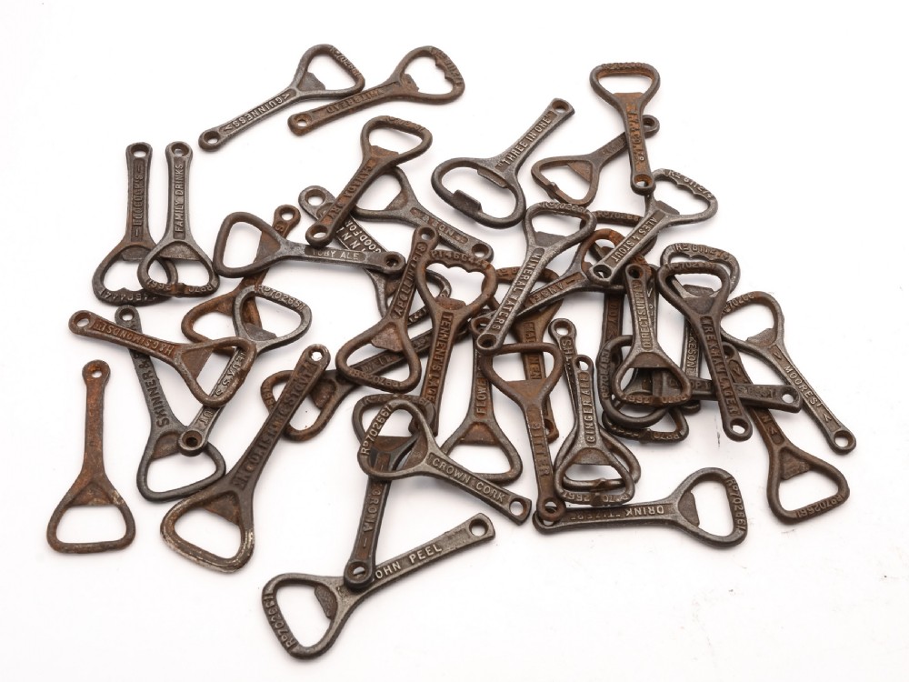 Collection of 40 Advertising Cast Iron Bottle Openers, Circa 1920