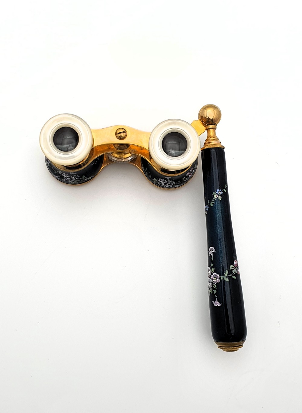 Edwardian opera glasses featuring black enamelled barrels with hand-painted floral patterns, mother of pearl eyepieces, lacquered brass fittings, and an extendable side handle. View III