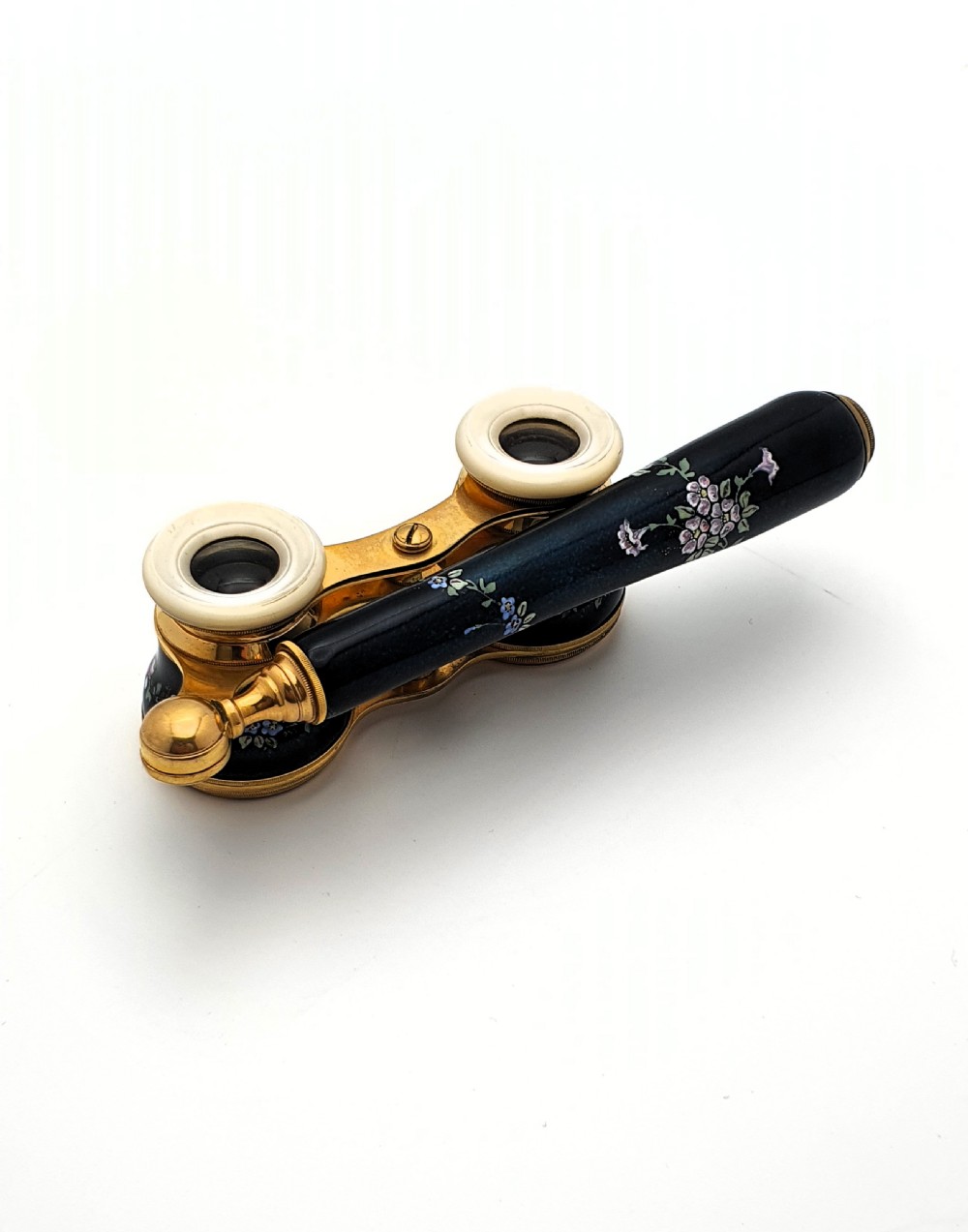 Edwardian opera glasses featuring black enamelled barrels with hand-painted floral patterns, mother of pearl eyepieces, lacquered brass fittings, and an extendable side handle. View VI