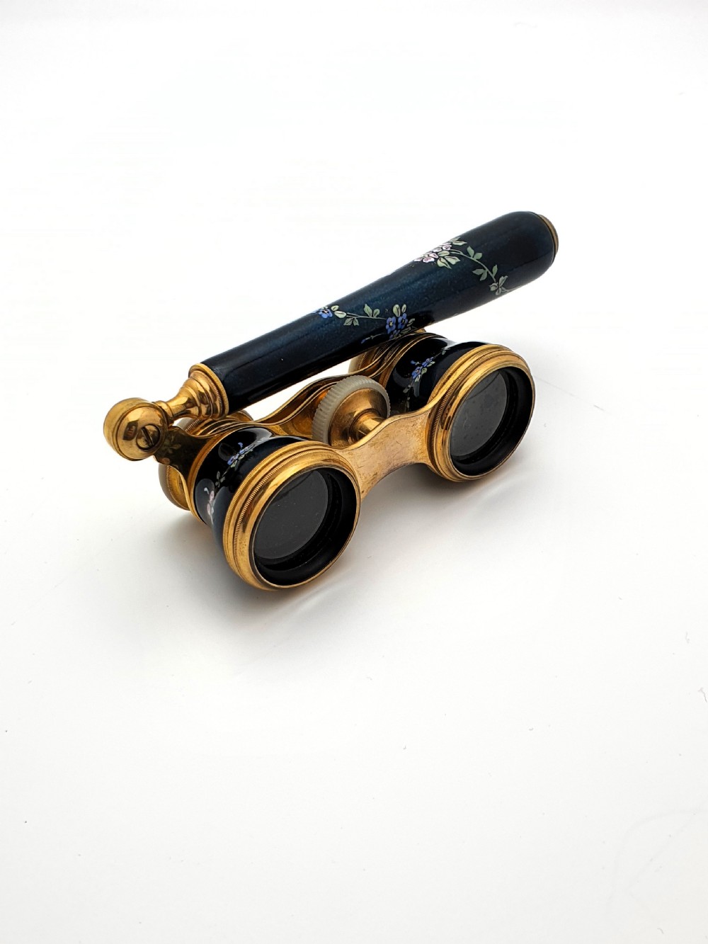 Edwardian opera glasses featuring black enamelled barrels with hand-painted floral patterns, mother of pearl eyepieces, lacquered brass fittings, and an extendable side handle. View IX