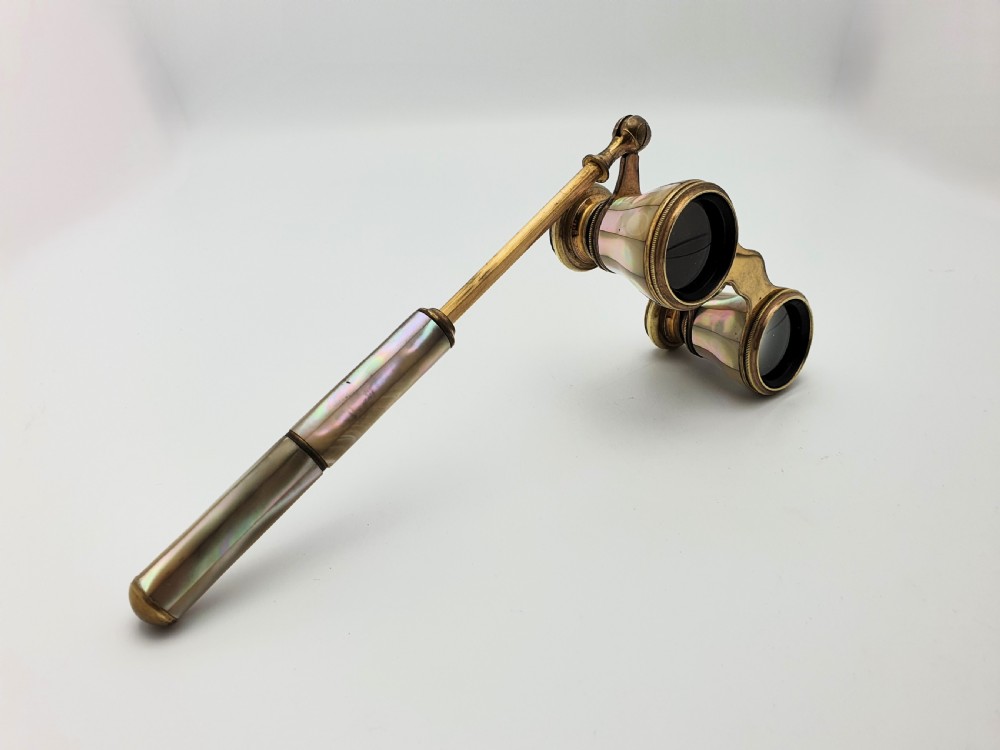 Victorian brass opera glasses featuring iridescent mother of pearl panels on the barrels and an extendable handle. View VIII