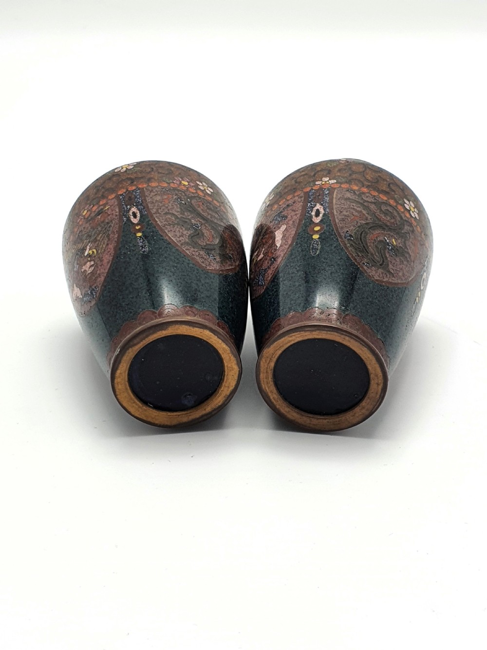 A pair of small dark brown Japanese cloisonne enamel vases decorated with bird and floral motifs. View V