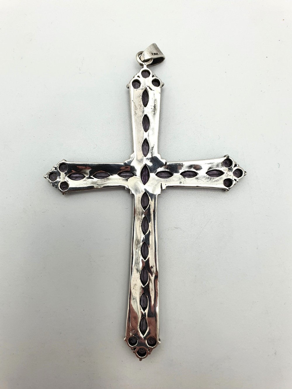 A silver cross pendant set with marquise-cut purple amethysts and detailed marcasite stones. View III