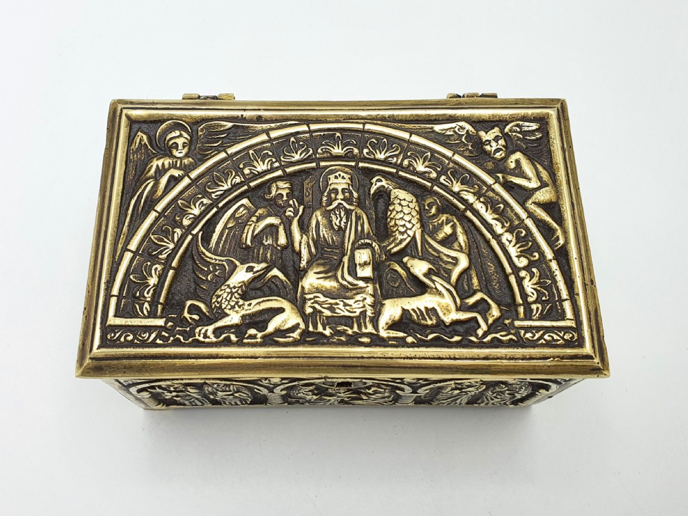 A rectangular brass jewellery box decorated with relief carvings of figures framed within arched arcades. View IV