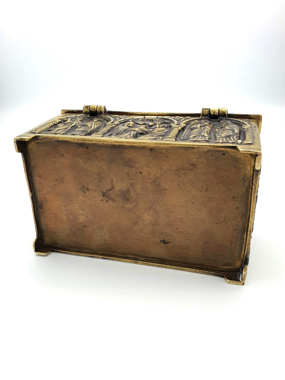 A rectangular brass jewellery box decorated with relief carvings of figures framed within arched arcades. View VI