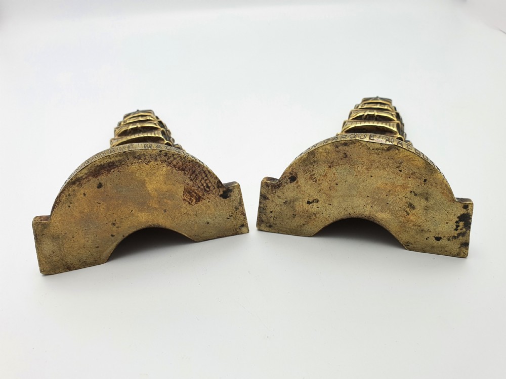 A pair of solid brass bookends featuring a relief design of a tall sailing ship on ocean waves. View VI