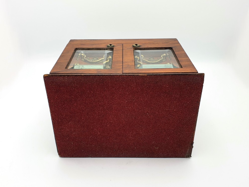 A Victorian walnut jewellery chest with open glass-panelled side doors, two pull-out drawers with brass handles, and an open lid revealing a button-tufted green velvet interior. View XII