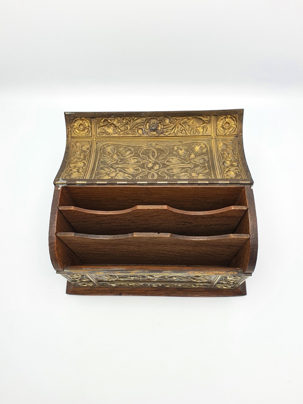 An Edwardian Art Nouveau document box featuring embossed floral brass panels over a dark timber base with a domed lid. View III