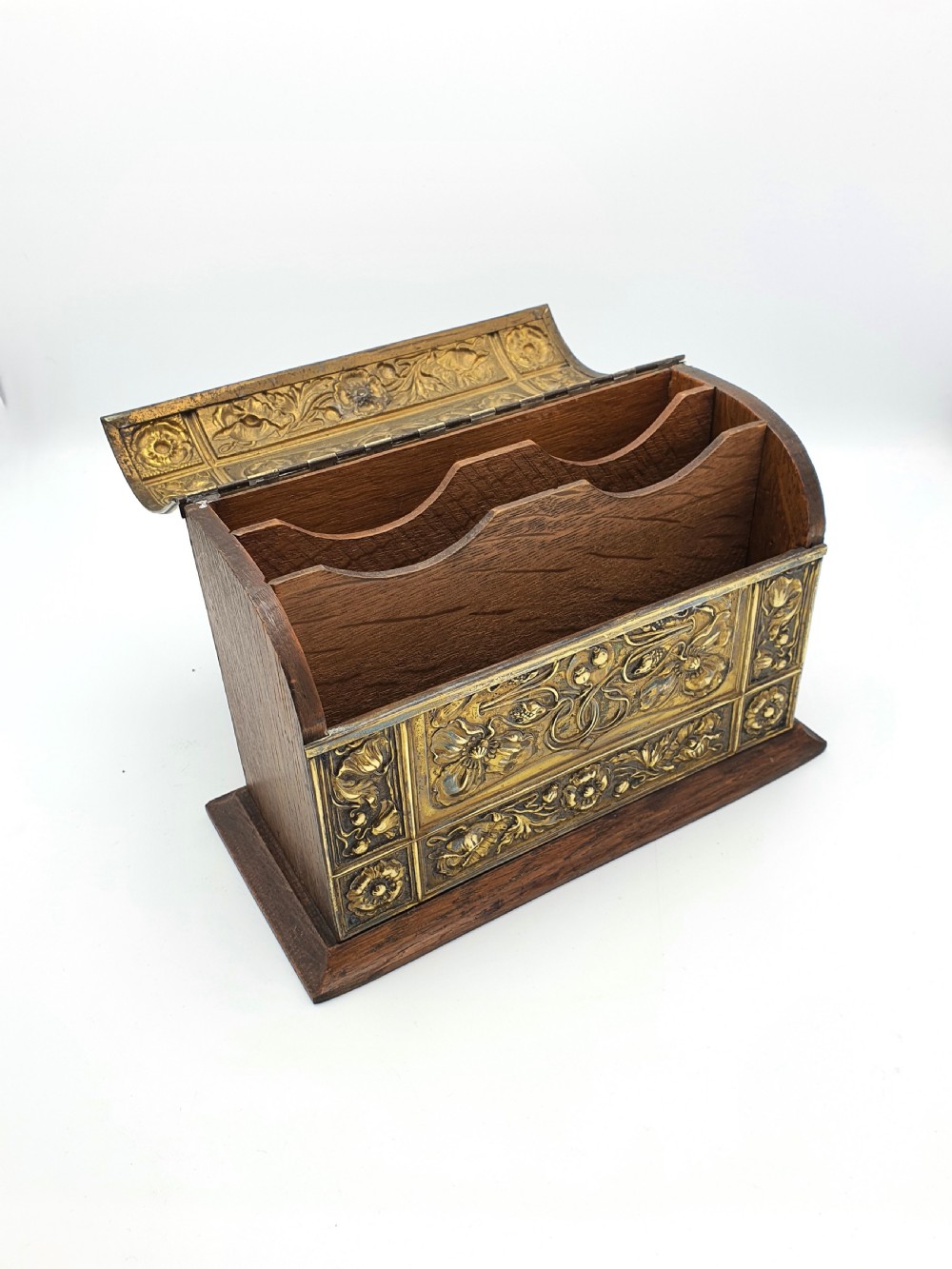 An Edwardian Art Nouveau document box featuring embossed floral brass panels over a dark timber base with a domed lid. View IV