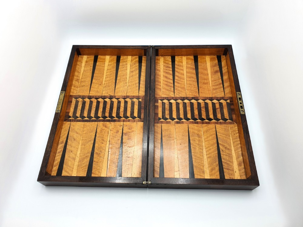 A Victorian folding wooden games box featuring a hand-inlaid checkered chessboard surface surrounded by figured timber borders. View II