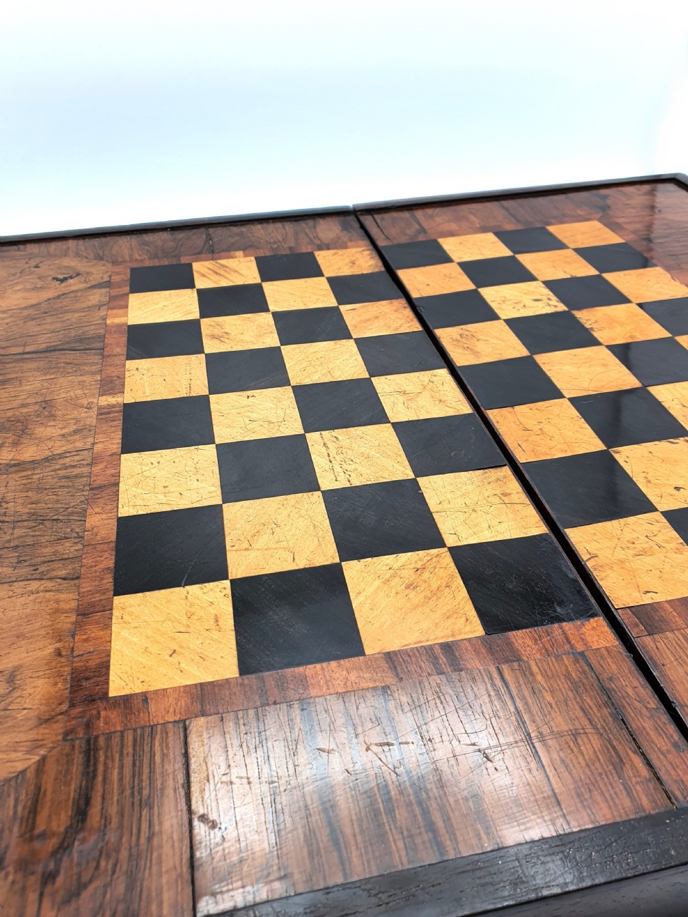 A Victorian folding wooden games box featuring a hand-inlaid checkered chessboard surface surrounded by figured timber borders. View III