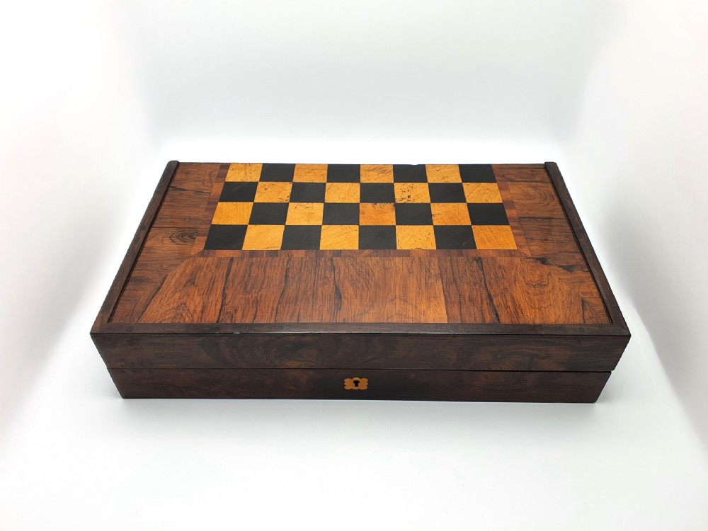 A Victorian folding wooden games box featuring a hand-inlaid checkered chessboard surface surrounded by figured timber borders. View V