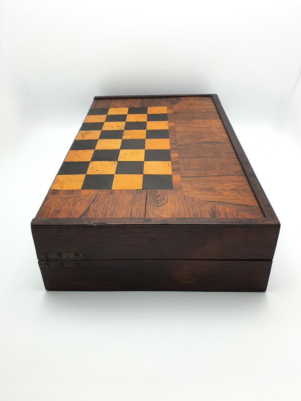 A Victorian folding wooden games box featuring a hand-inlaid checkered chessboard surface surrounded by figured timber borders. View VI