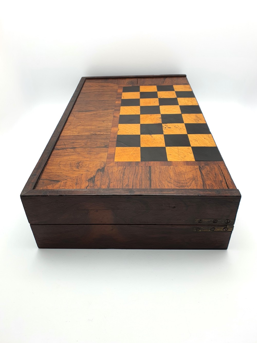 A Victorian folding wooden games box featuring a hand-inlaid checkered chessboard surface surrounded by figured timber borders. View VII