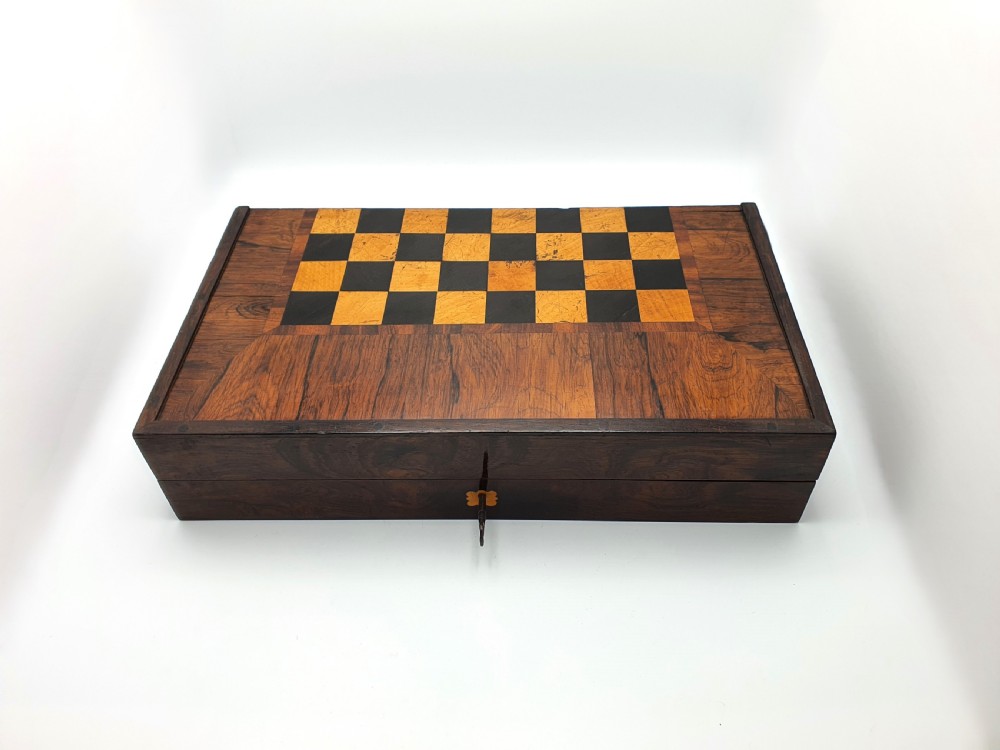 A Victorian folding wooden games box featuring a hand-inlaid checkered chessboard surface surrounded by figured timber borders. View IX