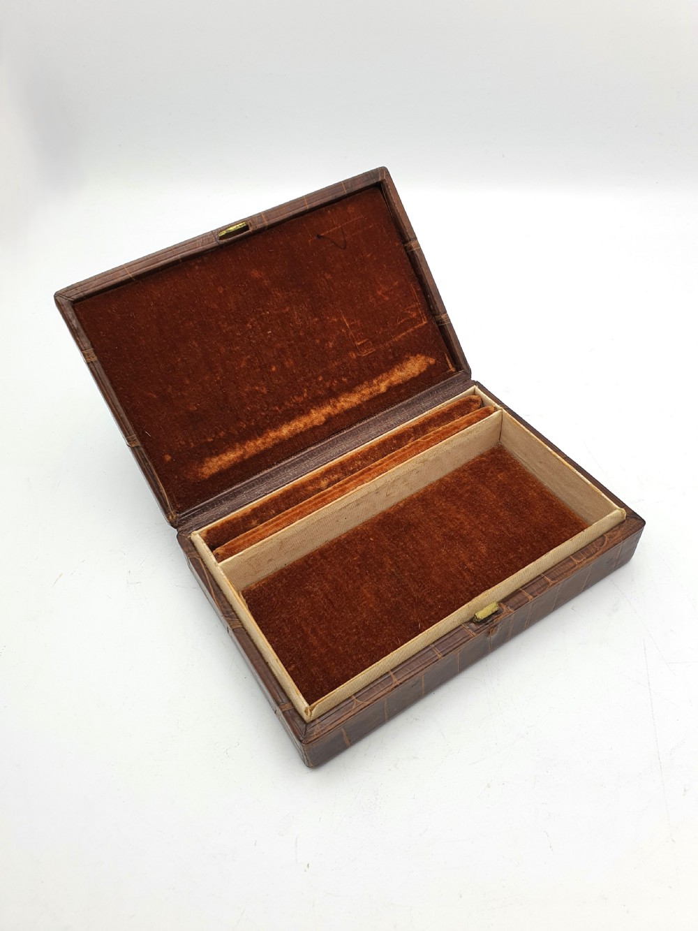 A rectangular 1920s jewellery box covered in polished chestnut brown crocodile skin with distinct natural scale patterning. View III