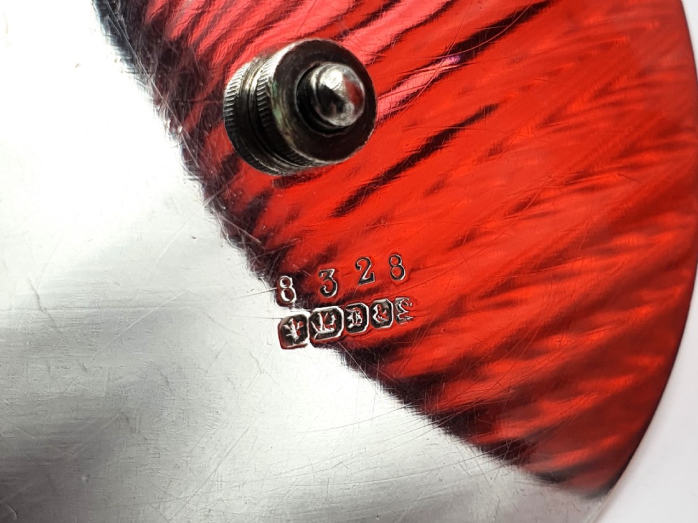 A Victorian ribbed cranberry red glass biscuit barrel featuring a silver-plated rim, handle mounts, and a lid surmounted by a stag head finial. View V