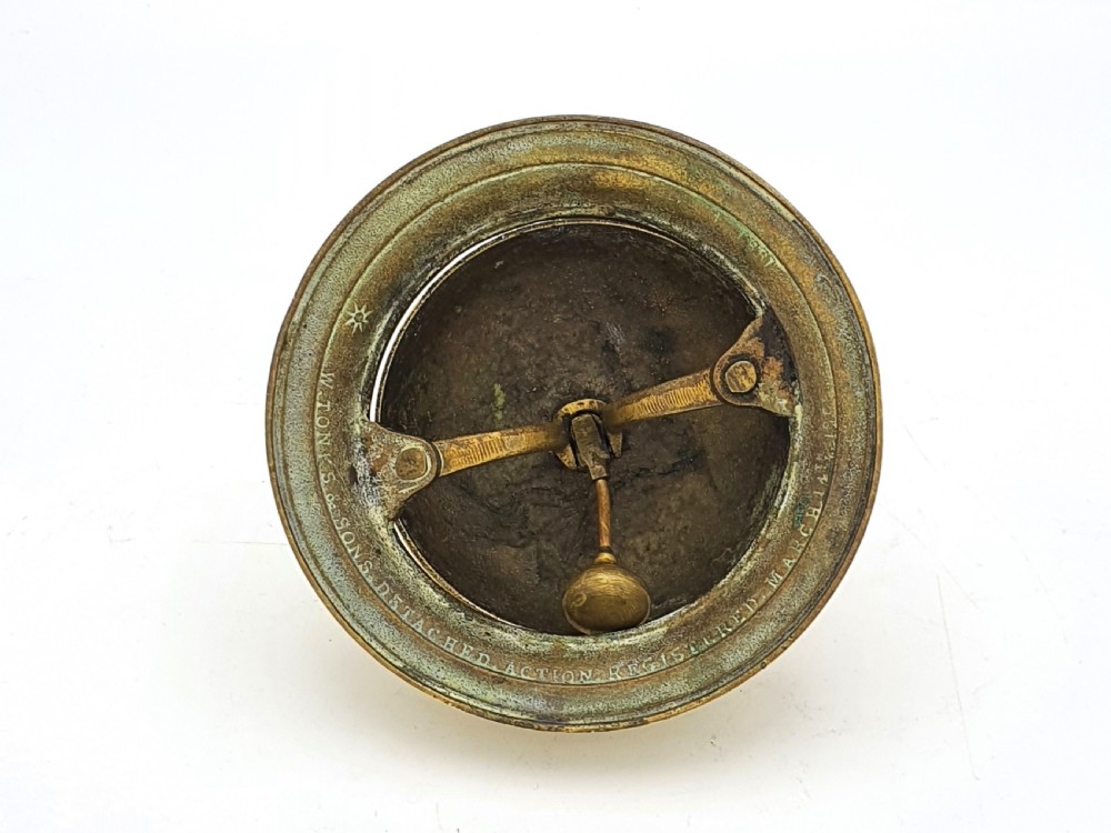 A polished Victorian brass counter bell featuring a circular stepped base, a hemispherical dome shell, and a central knurled push button. View III