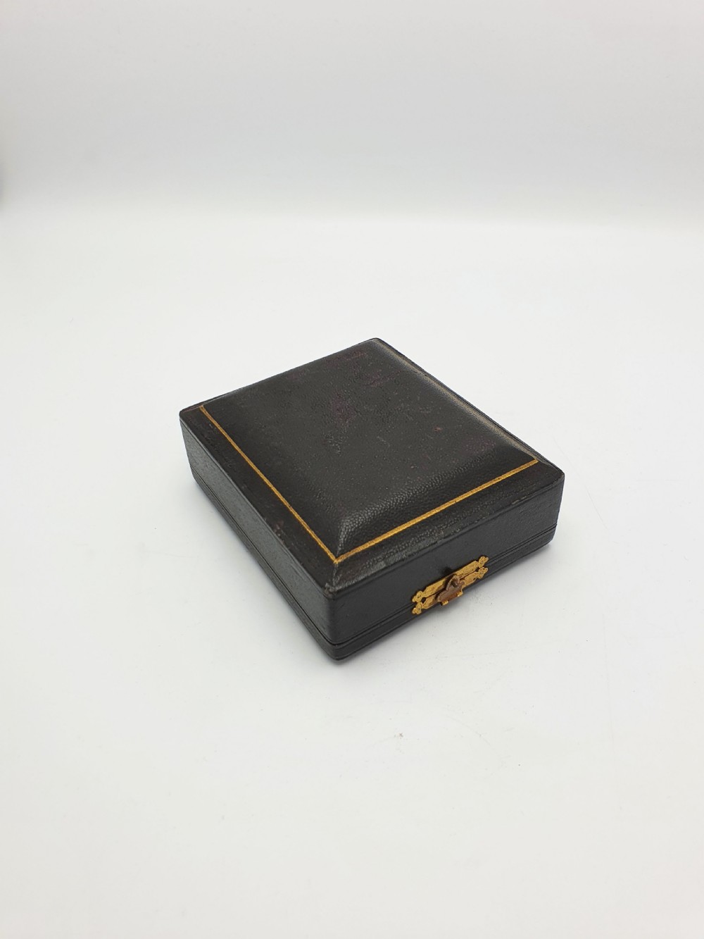 A pair of cut glass knife rests with hallmarked silver end caps housed in a dark blue velvet-lined fitted presentation case. View VII