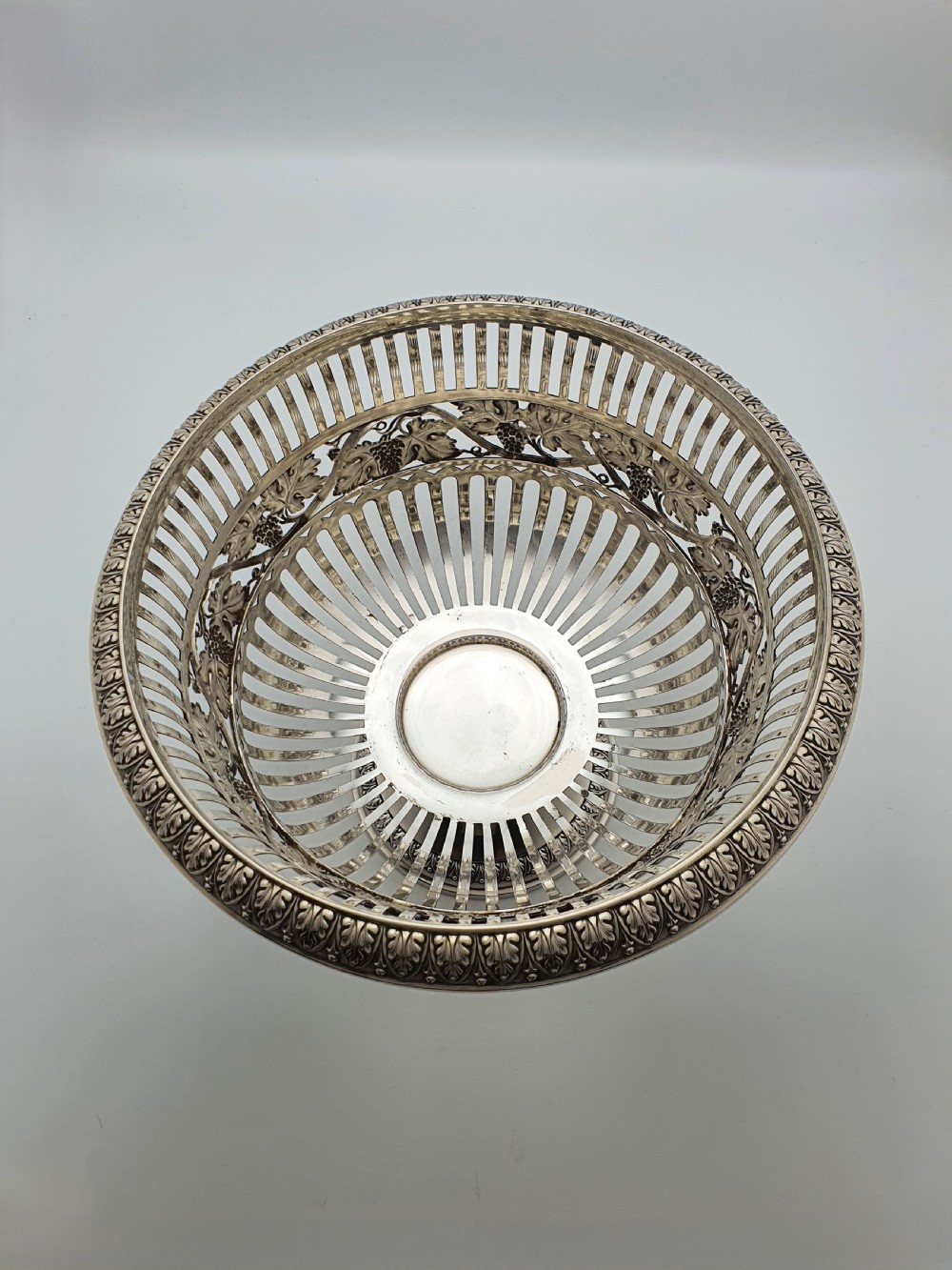 A German 800 silver centrepiece bowl featuring a pierced leaf and vine motif frame on a pedestal base with a cobalt blue glass liner. View IX