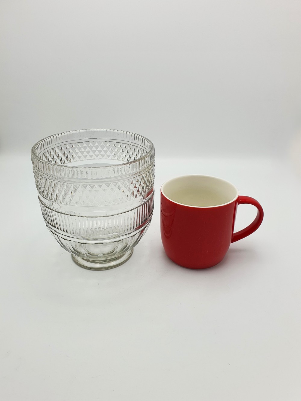 A Georgian cut clear glass tea mixing bowl featuring diamond cut patterns, step-cut bands, and a footed base. View VI